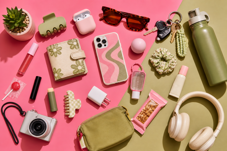 Flat lay of trendy accessories and personal items on a colorful background.