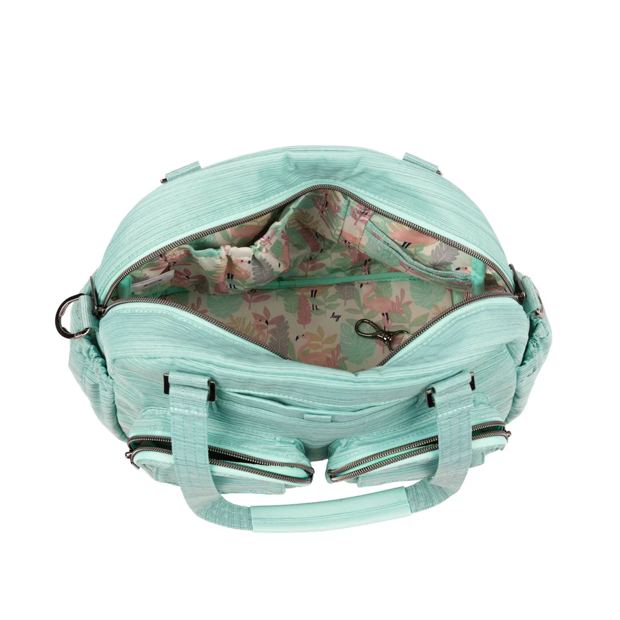 Open mint green bag with floral patterned interior.