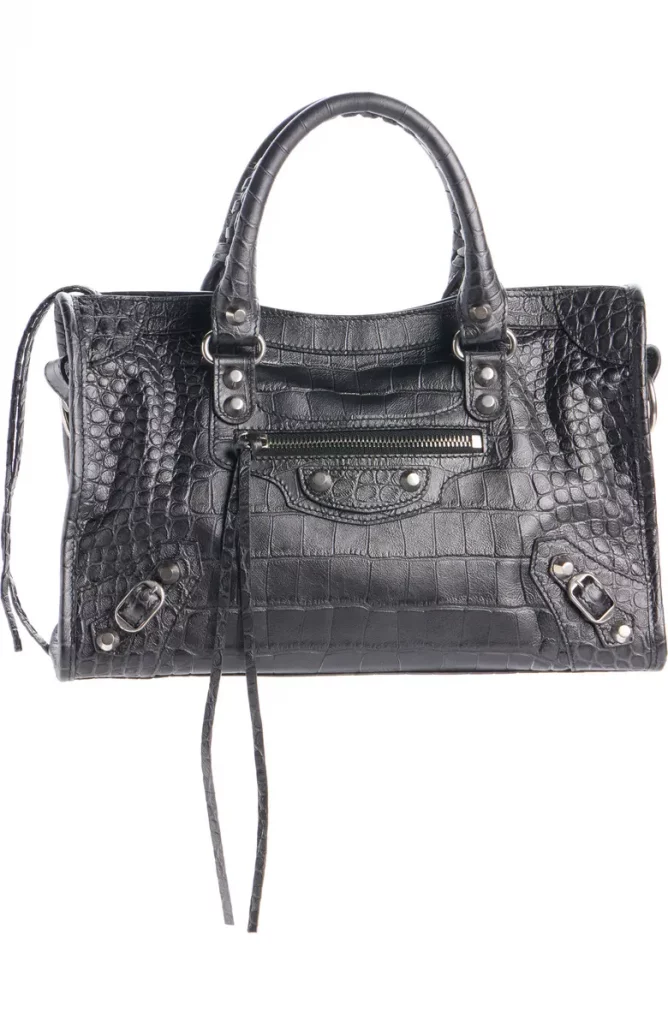 A stylish black crocodile leather handbag with dual handles and a zippered pocket.