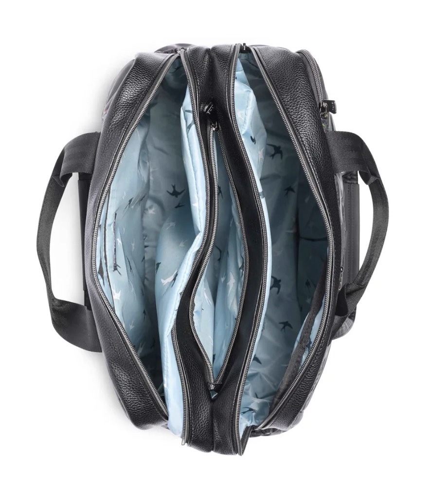 A top view of a stylish black bag opened to reveal its blue patterned interior.